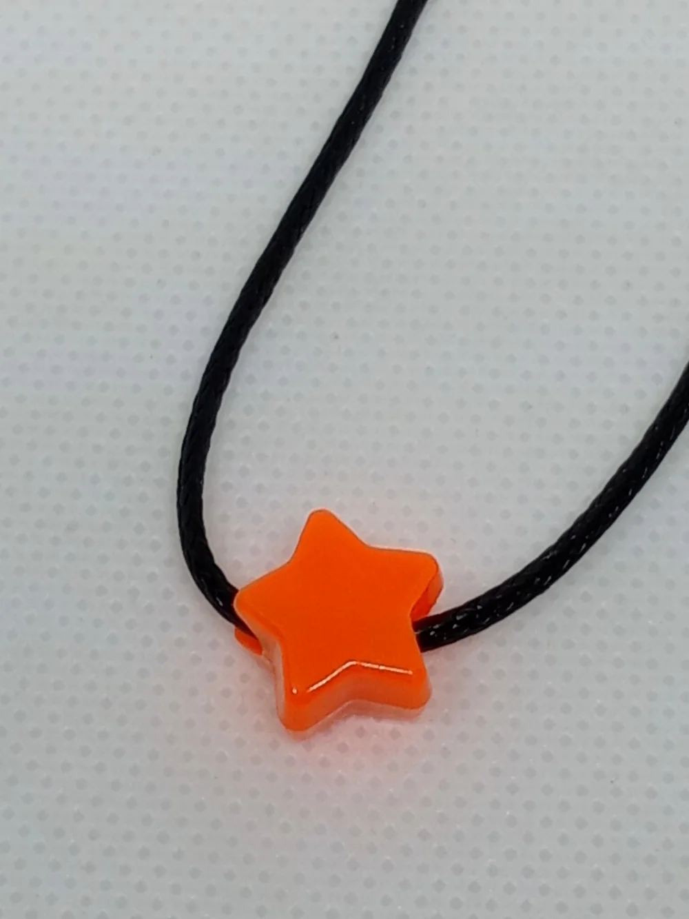 Orange Star Bead Necklace on Black Cord